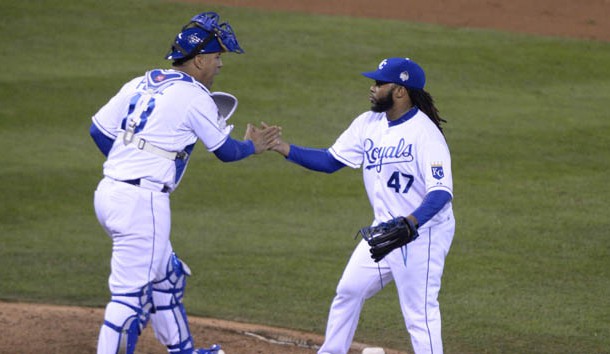 Oct 28, 2015; Kansas City, MO, USA; Kansas City Royals starting pitcher Johnny Cueto (47) celebrates with catcher Salvador Perez (13) after defeating the New York Mets in game two of the 2015 World Series at Kauffman Stadium. Mandatory Credit: John Rieger-USA TODAY Sports