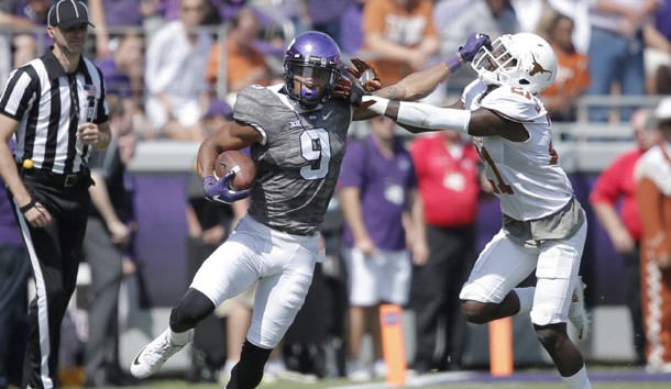 Oct 3, 2015; Fort Worth, TX, USA; Texas Christian University Horned Frogs wide receiver Josh Doctson (9) stiff arms University of Texas Longhorns cornerback Duke Thomas (21) in the second quarter at Amon G. Carter Stadium. Mandatory Credit: Erich Schlegel-USA TODAY Sports