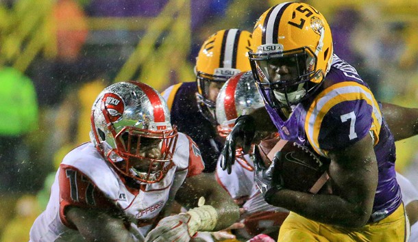 Oct 24, 2015; Baton Rouge, LA, USA; LSU Tigers running back Leonard Fournette (7) runs against the Western Kentucky Hilltoppers during the second quarter of a game at Tiger Stadium. Mandatory Credit: Derick E. Hingle-USA TODAY Sports