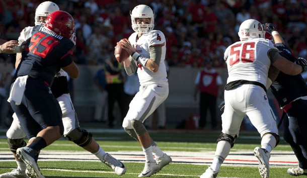 Oct 24, 2015; Tucson, AZ, USA; Washington State Cougars quarterback Luke Falk (4) looks to pass during the third quarter against the Arizona Wildcats at Arizona Stadium. The Cougars won 45-42. Mandatory Credit: Casey Sapio-USA TODAY Sports