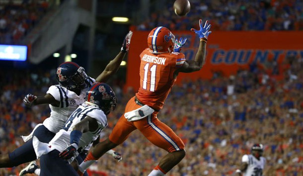 Oct 3, 2015; Gainesville, FL, USA; Florida Gators wide receiver Demarcus Robinson (11) catches the ball for a touchdown over Mississippi Rebels defensive back Mike Hilton (38) during the first quarter at Ben Hill Griffin Stadium. Mandatory Credit: Kim Klement-USA TODAY Sports