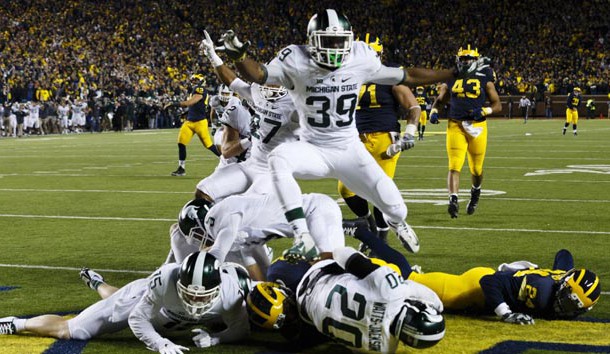 Oct 17, 2015; Ann Arbor, MI, USA; Michigan State Spartans defensive back Jalen Watts-Jackson (20) dives into the end zone for a game winning touchdown as the clock runs out in the fourth quarter against the Michigan Wolverines at Michigan Stadium. Michigan State 27-23. Mandatory Credit: Rick Osentoski-USA TODAY Sports