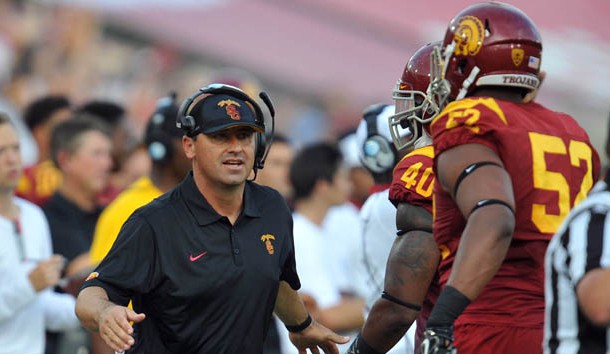 September 12, 2015; Los Angeles, CA, USA; Southern California Trojans head coach Steve Sarkisian greets defensive tackle Delvon Simmons (52) after a defensive play against the Idaho Vandals during the first half at Los Angeles Memorial Coliseum. Mandatory Credit: Gary A. Vasquez-USA TODAY Sports