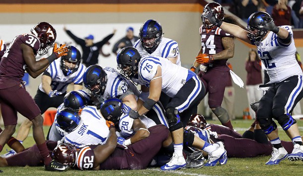 Oct 24, 2015; Blacksburg, VA, USA; Duke Blue Devils quarterback Thomas Sirk (1) scores the game-winning two point conversion as Virginia Tech Hokies defensive tackle Luther Maddy (92) defends in quadruple overtime at Lane Stadium. The Blue Devils won 45-43 in quadruple overtime. Mandatory Credit: Geoff Burke-USA TODAY Sports