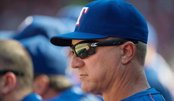 Oct 4, 2015; Arlington, TX, USA; Texas Rangers manager Jeff Banister (28) looks on from the dugout against the Los Angeles Angels at Globe Life Park in Arlington. The Rangers won 9-2 and clinch the American League West division. Mandatory Credit: Jerome Miron-USA TODAY Sports