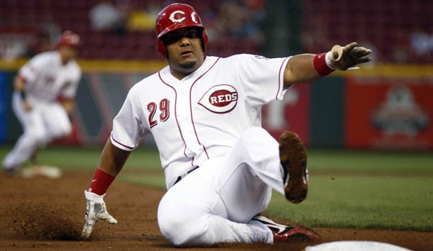 Sep 5, 2015; Cincinnati, OH, USA; Cincinnati Reds catcher Brayan Pena is forced out at third base against the Milwaukee Brewers during the second inning in game two of a doubleheader at Great American Ball Park. Mandatory Credit: David Kohl-USA TODAY Sports