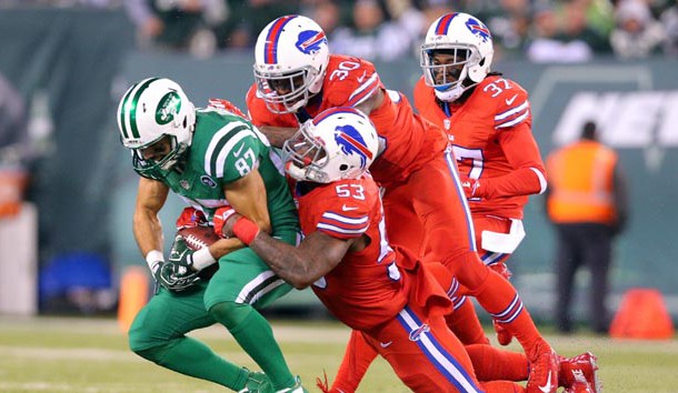 Nov 12, 2015; East Rutherford, NJ, USA; New York Jets wide receiver Eric Decker (87) catches a pass against Buffalo Bills linebacker Nigel Bradham (53) and Buffalo Bills safety Bacarri Rambo (30) and Buffalo Bills corner back Nickell Robey (37) during the third quarter at MetLife Stadium. The Bills defeated the Jets 22-17. Mandatory Credit: Brad Penner-USA TODAY Sports