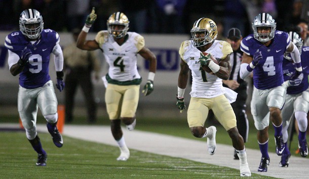 Nov 5, 2015; Manhattan, KS, USA; Baylor Bears return specialist Corey Coleman (1) carries the ball past Kansas State Wildcats defensive back Kaleb Prewett (4) and linebacker Elijah Lee (9) during the first half at Bill Snyder Family Football Stadium. Mandatory Credit: Scott Sewell-USA TODAY Sports