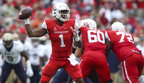 Nov 27, 2015; Houston, TX, USA; Houston Cougars quarterback Greg Ward Jr. (1) attempts a pass during the fourth quarter against the Navy Midshipmen at TDECU Stadium. The Cougars defeated the Midshipmen 52-31. Mandatory Credit: Troy Taormina-USA TODAY Sports