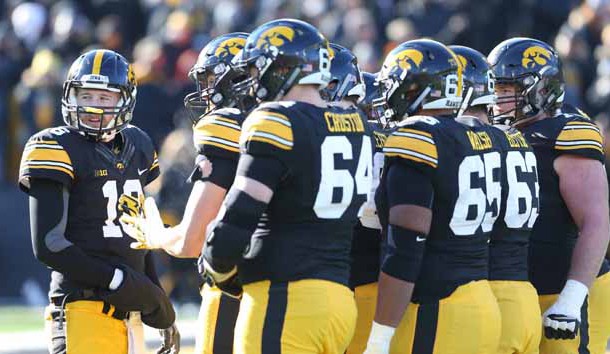 Nov 21, 2015; Iowa City, IA, USA;  Iowa Hawkeyes quarterback C.J. Beathard (16) talks to his team during the third quarter in their game with the Purdue Boilermakers at Kinnick Stadium. Iowa beat Purdue 40-20. Mandatory Credit: Reese Strickland-USA TODAY Sports
