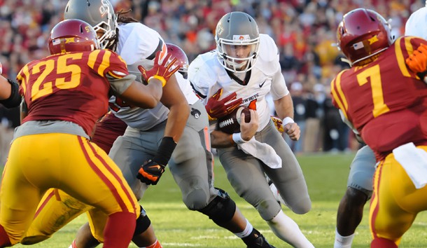 Nov 14, 2015; Ames, IA, USA; Oklahoma State Cowboys quarterback J.W. Walsh (4) runs with the ball against the Iowa State Cyclones at Jack Trice Stadium. Mandatory Credit: Steven Branscombe-USA TODAY Sports