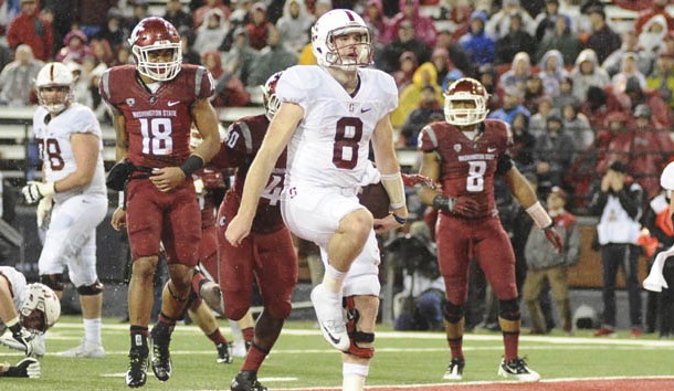 Oct 31, 2015; Pullman, WA, USA; Stanford Cardinal quarterback Kevin Hogan (8) scores a touchdown against the Washington State Cougars during the second half at Martin Stadium. The Cardinal won 30-28. Mandatory Credit: James Snook-USA TODAY Sports