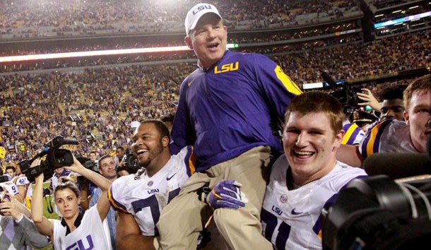 Nov 28, 2015; Baton Rouge, LA, USA; LSU Tigers head coach Les Miles is picked up by his players after defeating the Texas A&M Aggies 19-7 at Tiger Stadium. Mandatory Credit: Crystal LoGiudice-USA TODAY Sports