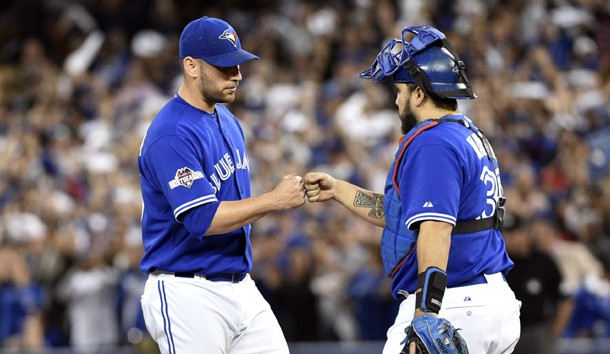 Oct 21, 2015; Toronto, Ontario, CAN; Toronto Blue Jays starting pitcher Marco Estrada (25) reacts with catcher Dioner Navarro (30) during the eighth inningin game five of the ALCS at Rogers Centre. Mandatory Credit: Nick Turchiaro-USA TODAY Sports