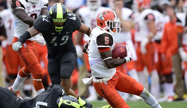 Sep 26, 2015; West Lafayette, IN, USA; Bowling Green Falcons wide receiver Ronnie Moore (5) evades a tackle from Purdue Boilermakers linebacker Ja'Whaun Bentley (4)  during the second half of the game at Ross Ade Stadium. The Bowling Green Falcons defeated the Purdue Boilermakers 35 to 28.  Mandatory Credit: Marc Lebryk-USA TODAY Sports