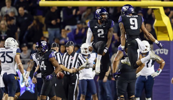 Oct 29, 2015; Fort Worth, TX, USA; TCU Horned Frogs quarterback Trevone Boykin (2) celebrates with wide receiver Josh Doctson (9) after throwing a touchdown pass during the second half against the West Virginia Mountaineers at Amon G. Carter Stadium. Mandatory Credit: Kevin Jairaj-USA TODAY Sports
