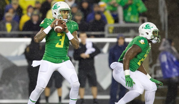 Nov 7, 2015; Eugene, OR, USA; Oregon Ducks quarterback Vernon Adams Jr. (3) throws the ball as Ducks running back Royce Freeman (21) defends against the California Golden Bears at Autzen Stadium. Mandatory Credit: Scott Olmos-USA TODAY Sports