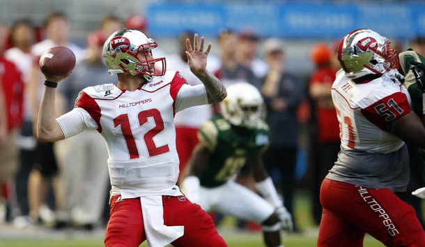 Dec 21, 2015; Miami, FL, USA; Western Kentucky Hilltoppers quarterback Brandon Doughty (12) throws a pass against South Florida Bulls during the second half in the 2015 Miami Beach Bowl at Marlins Park. Mandatory Credit: Steve Mitchell-USA TODAY Sports