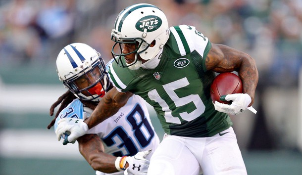 Dec 13, 2015; East Rutherford, NJ, USA; New York Jets wide receiver Brandon Marshall (15) runs past Tennessee Titans corner back B.W. Webb (38) during the fourth quarter at MetLife Stadium. The Jets defeated the Titans 30-8. Mandatory Credit: Brad Penner-USA TODAY Sports