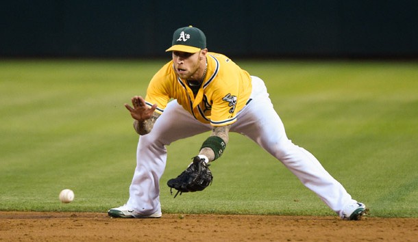 August 21, 2015; Oakland, CA, USA; Oakland Athletics second baseman Brett Lawrie (15) catches a ground ball during the third inning against the Tampa Bay Rays at O.co Coliseum. The Rays defeated the Athletics 2-1. Mandatory Credit: Kyle Terada-USA TODAY Sports