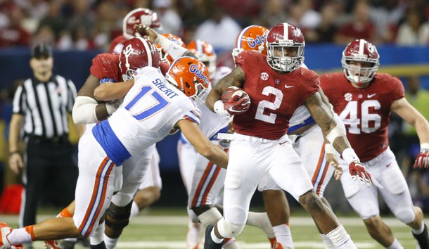 Dec 5, 2015; Atlanta, GA, USA; Alabama Crimson Tide running back Derrick Henry (2) carries the ball past Florida Gators defensive lineman Jordan Sherit (17) during the fourth quarter in the 2015 SEC Championship Game at the Georgia Dome. Mandatory Credit: Brett Davis-USA TODAY Sports