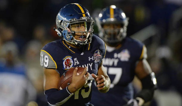 Dec 28, 2015; Annapolis, MD, USA; Navy Midshipmen quarterback Keenan Reynolds (19) rushes for his third touchdown of the game in the fourth quarter against the Pittsburgh Panthers  at Navy-Marine Corps. Stadium. Mandatory Credit: Tommy Gilligan-USA TODAY Sports