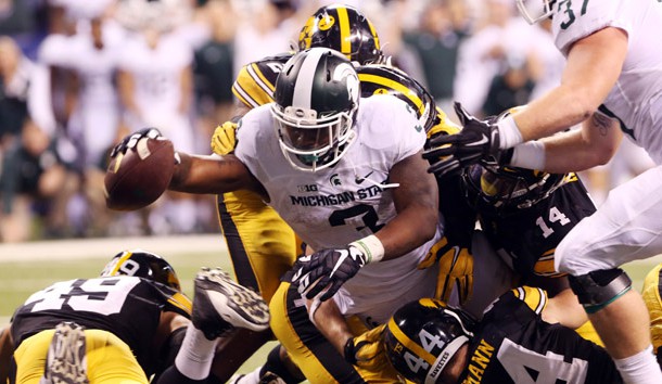 Dec 5, 2015; Indianapolis, IN, USA; Michigan State Spartans running back LJ Scott (3) dives in for a touchdown during the fourth quarter of  the Big Ten Conference football championship game against the Iowa Hawkeyes at Lucas Oil Stadium. Mandatory Credit: Aaron Doster-USA TODAY Sports