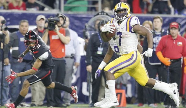 Dec 29, 2015; Houston, TX, USA; LSU Tigers running back Leonard Fournette (7) catches the ball and runs for a touchdown against the Texas Tech Red Raiders in the second quarter at NRG Stadium. Mandatory Credit: Thomas B. Shea-USA TODAY Sports