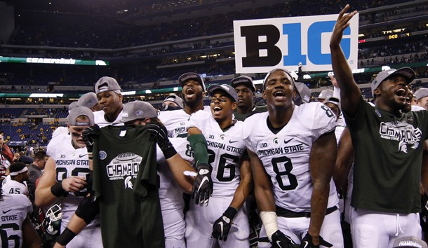 Dec 5, 2015; Indianapolis, IN, USA; Michigan State players celebrate after defeating the Iowa Hawkeyes during in the Big Ten Conference football championship game at Lucas Oil Stadium. Mandatory Credit: Brian Spurlock-USA TODAY Sports