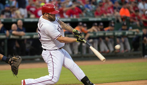Sep 16, 2015; Arlington, TX, USA; Texas Rangers left fielder Mike Napoli (25) hits a three run home run against the Houston Astros during the first inning at Globe Life Park in Arlington. Mandatory Credit: Jerome Miron-USA TODAY Sports