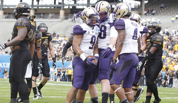 Dec 26, 2015; Dallas, TX, USA; Washington Huskies fullback Myles Gaskin (9) is congratulated after scoring a touchdown by tight end Drew Sample (88) and wide receiver Jaydon Mickens (4) in the first quarter against the Southern Miss Golden Eagles at Cotton Bowl Stadium. Mandatory Credit: Tim Heitman-USA TODAY Sports