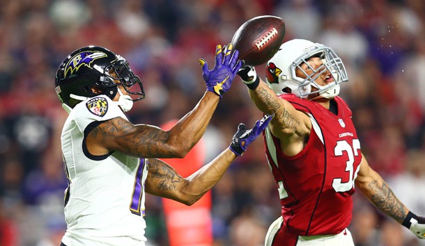 Oct 26, 2015; Glendale, AZ, USA; Arizona Cardinals safety Tyrann Mathieu (right) breaks up a pass intended for Baltimore Ravens wide receiver Chris Givens in the second quarter at University of Phoenix Stadium. Mandatory Credit: Mark J. Rebilas-USA TODAY Sports