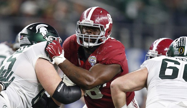 Dec 31, 2015; Arlington, TX, USA; Alabama Crimson Tide defensive tackle A'Shawn Robinson (86) in action in the 2015 CFP semifinal at the Cotton Bowl against Michigan State Spartans guard Brian Allen (65) at AT&T Stadium. Mandatory Credit: Matthew Emmons-USA TODAY Sports