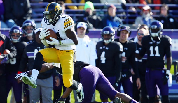 Oct 17, 2015; Evanston, IL, USA; Iowa Hawkeyes defensive back Desmond King (14) intercepts a pass intended for Northwestern Wildcats wide receiver Christian Jones (14) during the first quarter at Ryan Field. Mandatory Credit: Jerry Lai-USA TODAY Sports