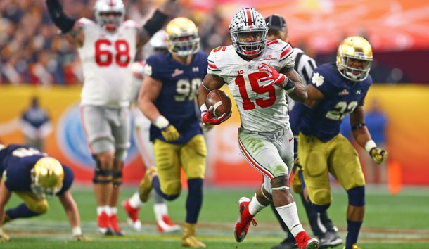 Jan 1, 2016; Glendale, AZ, USA; Ohio State Buckeyes running back Ezekiel Elliott (15) runs the ball against the Notre Dame Fighting Irish during the 2016 Fiesta Bowl at University of Phoenix Stadium. The Buckeyes defeated the Fighting Irish 44-28. Mandatory Credit: Mark J. Rebilas-USA TODAY Sports