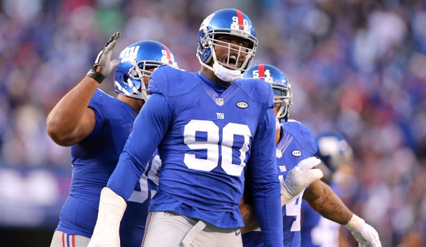 Dec 20, 2015; East Rutherford, NJ, USA; New York Giants defensive end Jason Pierre-Paul (90) reacts after blocking a pass by Carolina Panthers quarterback Cam Newton (not pictured) during the fourth quarter at MetLife Stadium. The Panthers defeated the Giants 38-35. Mandatory Credit: Brad Penner-USA TODAY Sports