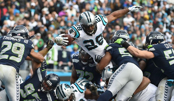 Jan 17, 2016; Charlotte, NC, USA; Carolina Panthers running back Jonathan Stewart (28) scores on a 1-yard touchdown carry over Seattle Seahawks middle linebacker Bobby Wagner (54) and Brock Coyle (52) during the second quarter in the NFC Divisional round playoff game at Bank of America Stadium. Photo Credit: Kirby Lee-USA TODAY Sports