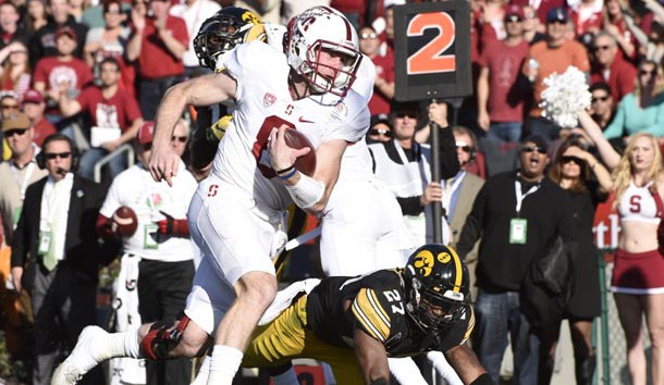 Jan 1, 2016; Pasadena, CA, USA; Stanford Cardinal quarterback Kevin Hogan (8) runs for a touchdown against the Iowa Hawkeyes during the first quarter in the 2016 Rose Bowl at Rose Bowl. Mandatory Credit: Richard Mackson-USA TODAY Sports