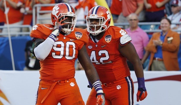 Dec 31, 2015; Miami Gardens, FL, USA; Clemson Tigers defensive end Shaq Lawson (90) and defensive lineman Christian Wilkins (42) react after a sack against the Oklahoma Sooners in the first quarter of the 2015 CFP Semifinal at the Orange Bowl at Sun Life Stadium. Mandatory Credit: Kim Klement-USA TODAY Sports