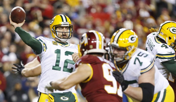 Jan 10, 2016; Landover, MD, USA; Green Bay Packers quarterback Aaron Rodgers (12) throws the ball over Washington Redskins outside linebacker Ryan Kerrigan (91) during the first half in a NFC Wild Card playoff football game at FedEx Field. Mandatory Credit: Geoff Burke-USA TODAY Sports