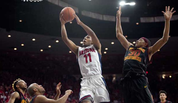 Feb 14, 2016; Tucson, AZ, USA; Arizona Wildcats guard Allonzo Trier (11) shoots the ball as he is defended by Southern California Trojans guard Jordan McLaughlin (left) and guard Julian Jacobs (12) and guard Elijah Stewart (30) during the second half at McKale Center. Arizona won 86-78. Mandatory Credit: Casey Sapio-USA TODAY Sports