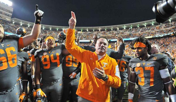 Butch Jones waves to fans as he celebrates with his team after defeating the Georgia Bulldogs during the second half at Neyland Stadium last year. Tennessee won 38-31. Photo Credit: Jim Brown-USA TODAY Sports