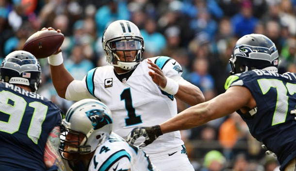 Jan 17, 2016; Charlotte, NC, USA; Carolina Panthers quarterback Cam Newton (1) throws the ball under pressure from Seattle Seahawks defensive end Michael Bennett (72) and Cassius Marsh (91) in the third quarter during the NFC Divisional round playoff game at Bank of America Stadium. Mandatory Credit: Kirby Lee-USA TODAY Sports
