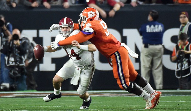 Jan 11, 2016; Glendale, AZ, USA; Alabama Crimson Tide quarterback Jake Coker (14) is sacked by Clemson Tigers defensive end Shaq Lawson (90) during the second quarter in the 2016 CFP National Championship at University of Phoenix Stadium. Photo Credit: Kirby Lee-USA TODAY Sports
