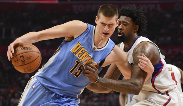 Mar 27, 2016; Los Angeles, CA, USA; Denver Nuggets center Nikola Jokic (15) is defended by Los Angeles Clippers center DeAndre Jordan (6) during an NBA game at Staples Center. Mandatory Credit: Kirby Lee-USA TODAY Sports