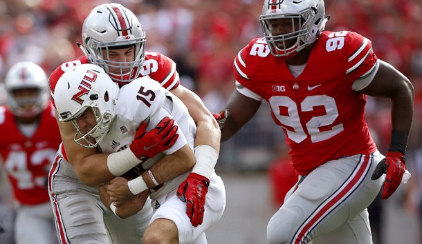 Sep 19, 2015; Columbus, OH, USA; Ohio State Buckeyes defensive lineman Joey Bosa (97) tackles Northern Illinois Huskies punter Jake Ambrose on a botched snap during the second quarter at Ohio Stadium. The game is tied 10-10 at half.  Photo Credit: Joe Maiorana-USA TODAY Sports
