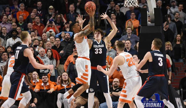 Mar 25, 2016; Chicago, IL, USA; Syracuse Orange forward Michael Gbinije (0) scores the go-ahead basket against Gonzaga Bulldogs forward Kyle Wiltjer (33) during the second half in a semifinal game in the Midwest regional of the NCAA Tournament at United Center. Mandatory Credit: David Banks-USA TODAY Sports