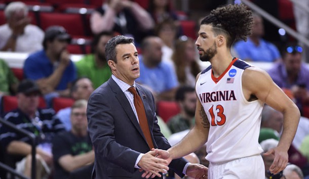 Mar 17, 2016; Raleigh, NC, USA; Virginia Cavaliers head coach Tony Bennett (L) high fives forward Anthony Gill (13) during the second half against the Hampton Pirates at PNC Arena. The Cavaliers won 81-45. Mandatory Credit: Bob Donnan-USA TODAY Sports