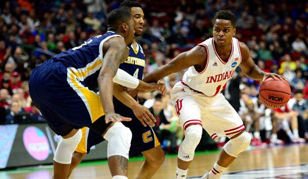 Mar 17, 2016; Des Moines, IA, USA; Indiana Hoosiers guard Yogi Ferrell (11) handles the ball against Chattanooga Mocs guard ZaQwaun Matthews (3) and guard Johnathan Burroughs-Cook (4) during the first half in the first round of the 2016 NCAA Tournament at Wells Fargo Arena. Mandatory Credit: Jeffrey Becker-USA TODAY Sports