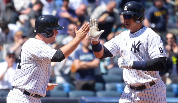 Apr 17, 2016; Bronx, NY, USA; New York Yankees designated hitter Alex Rodriguez (13) high fives catcher Brian McCann (34) after hitting a two run home run against the Seattle Mariners during the second inning at Yankee Stadium. Mandatory Credit: Brad Penner-USA TODAY Sports